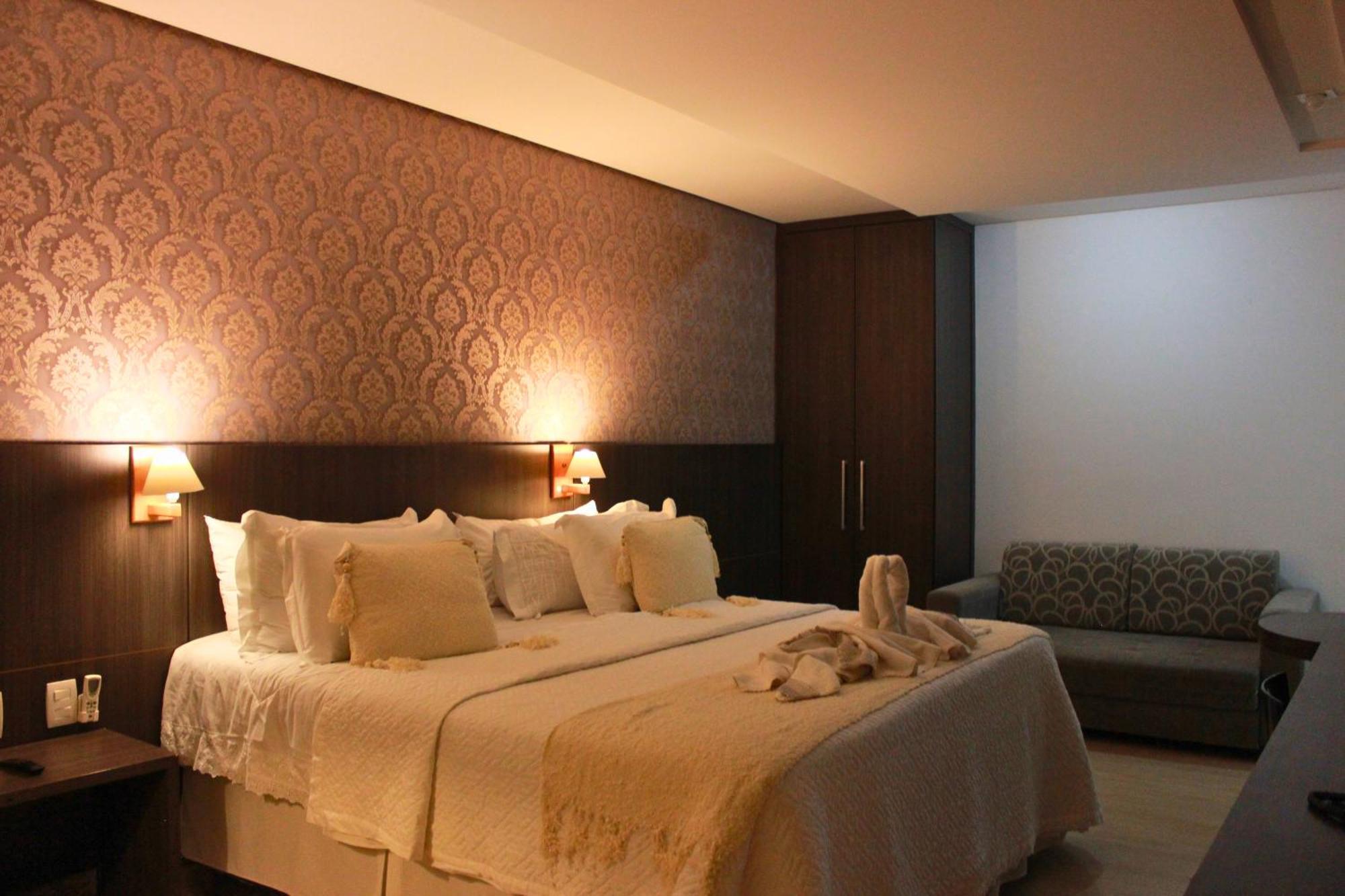 Gontijo Inn Hotel Itajubá Exteriér fotografie A bedroom in a hotel